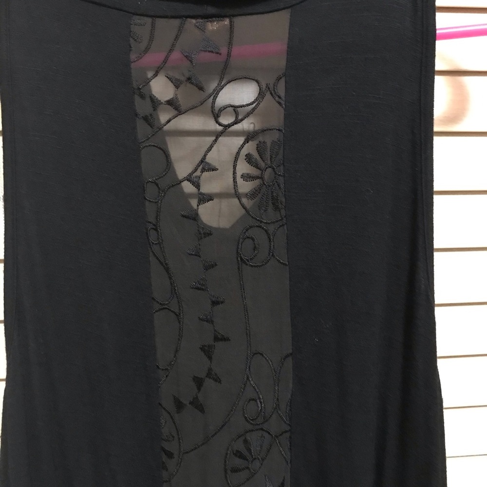 Knit dress with fringes.